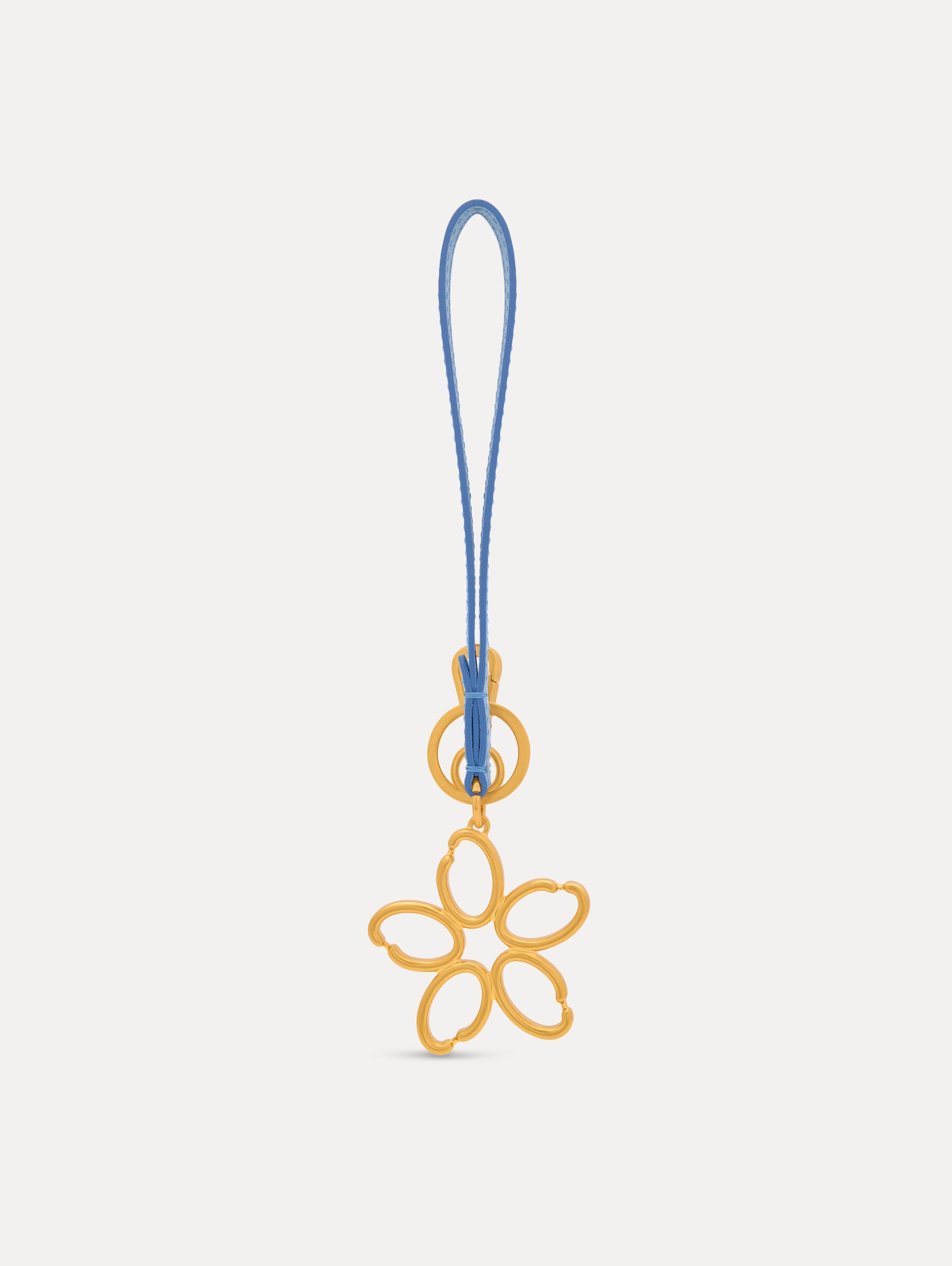 Gold O Flower Wristlet Key Chain with five open petals hangs from a blue leather loop strap, attached by a small gold ring and clasp. Front View.