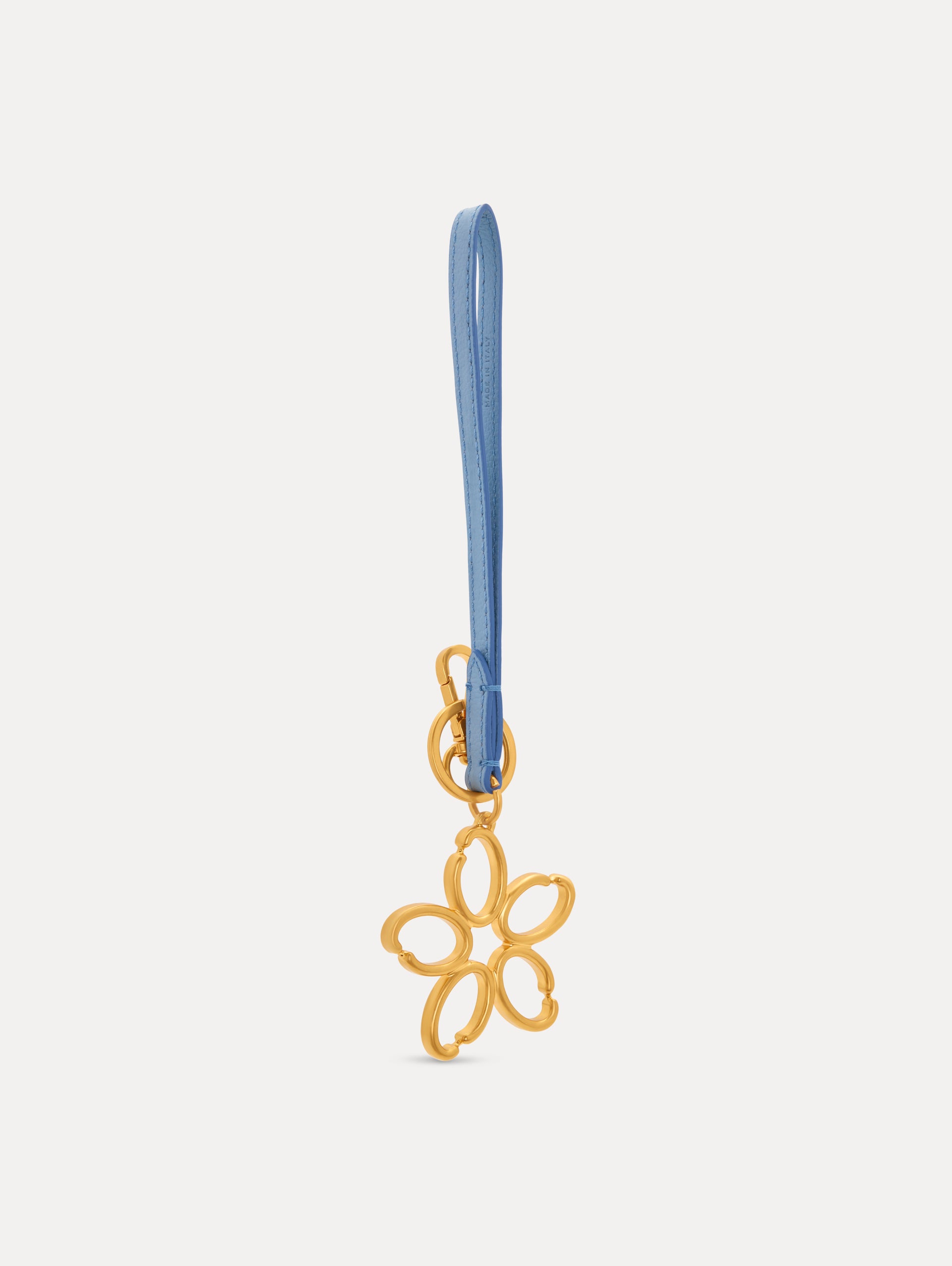 Gold O Flower Wristlet Key Chain with five open petals hangs from a blue leather loop strap, attached by a small gold ring and clasp. Side View.