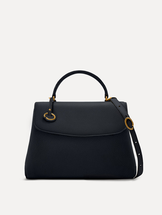 The Poppy leather bag in dark navy with O logo tag around the top handle. Front View