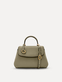 The Mini Poppy top handle bag in green. Front view. 