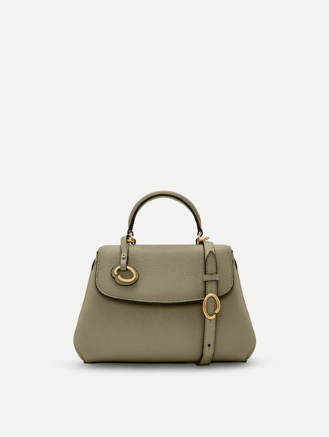 The Mini Poppy top handle bag in green. Front view. 