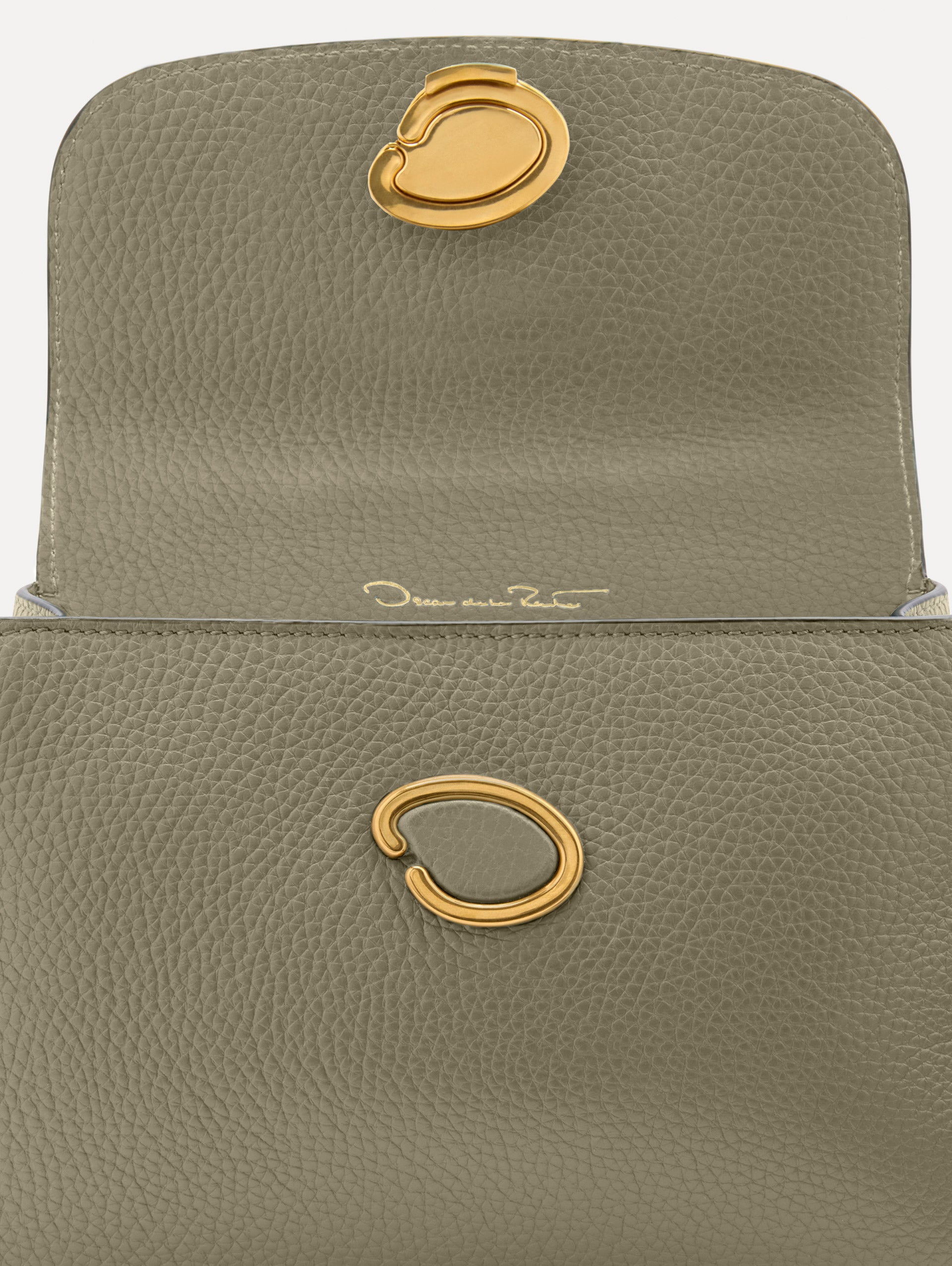 The Mini Poppy top handle bag in green. Zoom View.