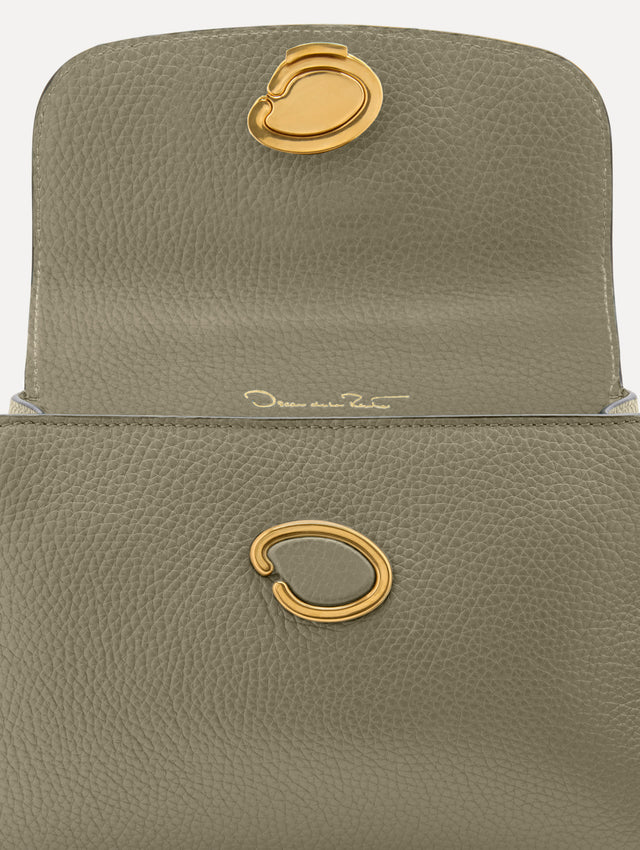 The Mini Poppy top handle bag in green. Zoom View.