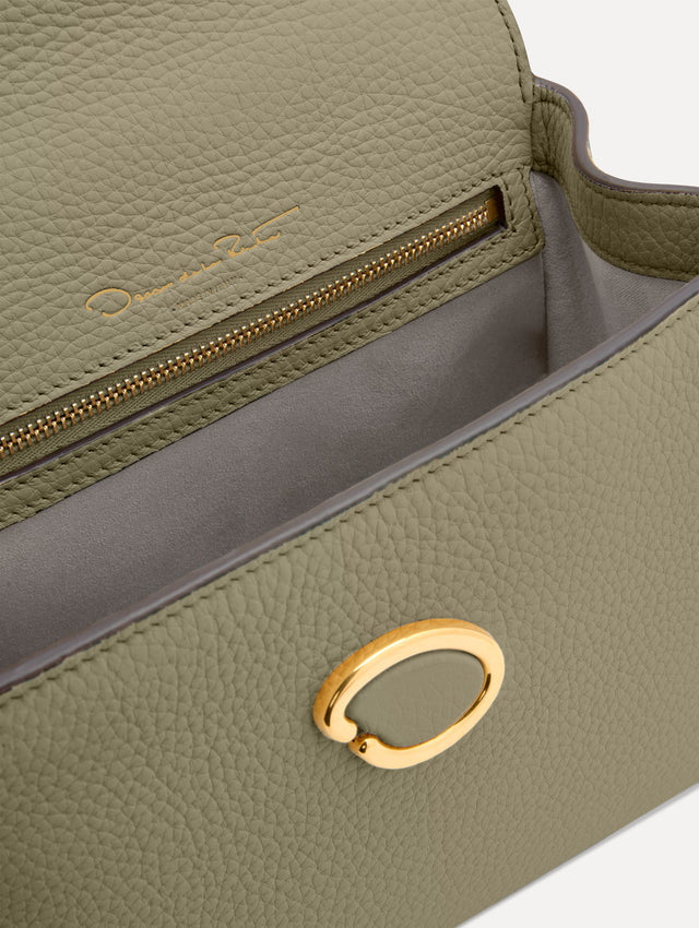The Mini Poppy top handle bag in green. Zoom View.