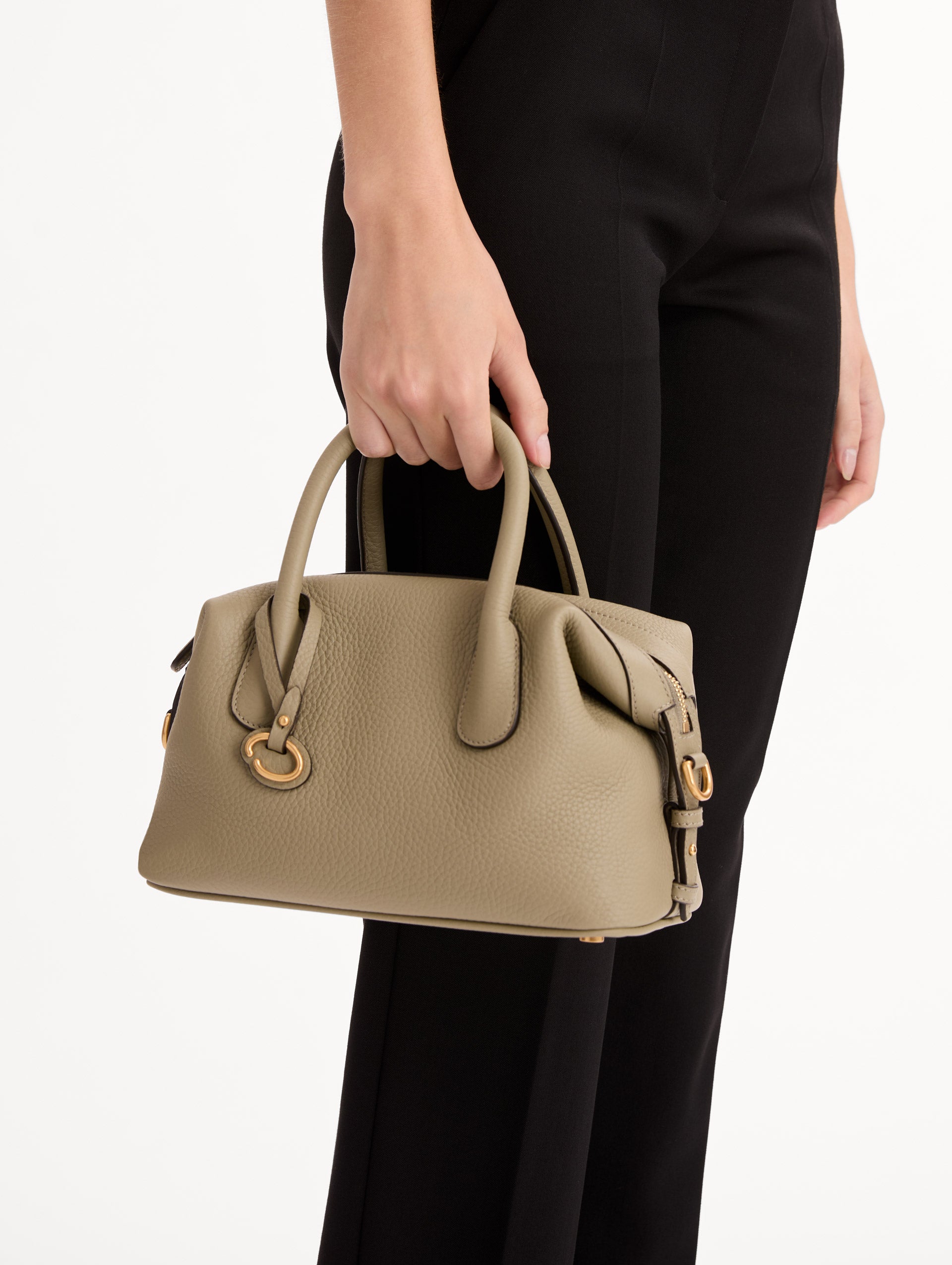 The Mini Dahlia in light green with gold hardware. Front View.