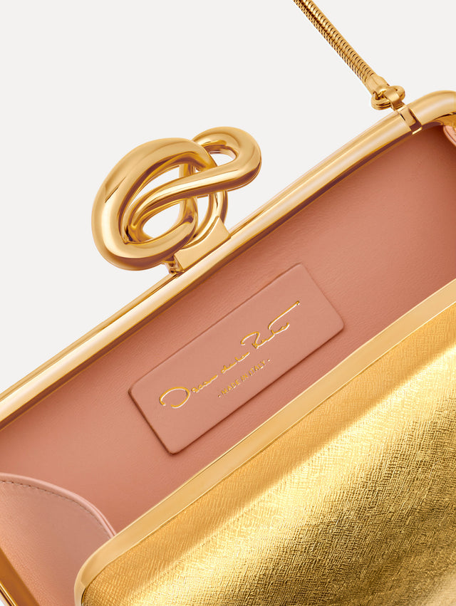 The Knot Minaudière in Gold. Detail View.