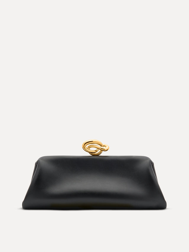 Black clutch with gold 'O' emblem on the clasp. 