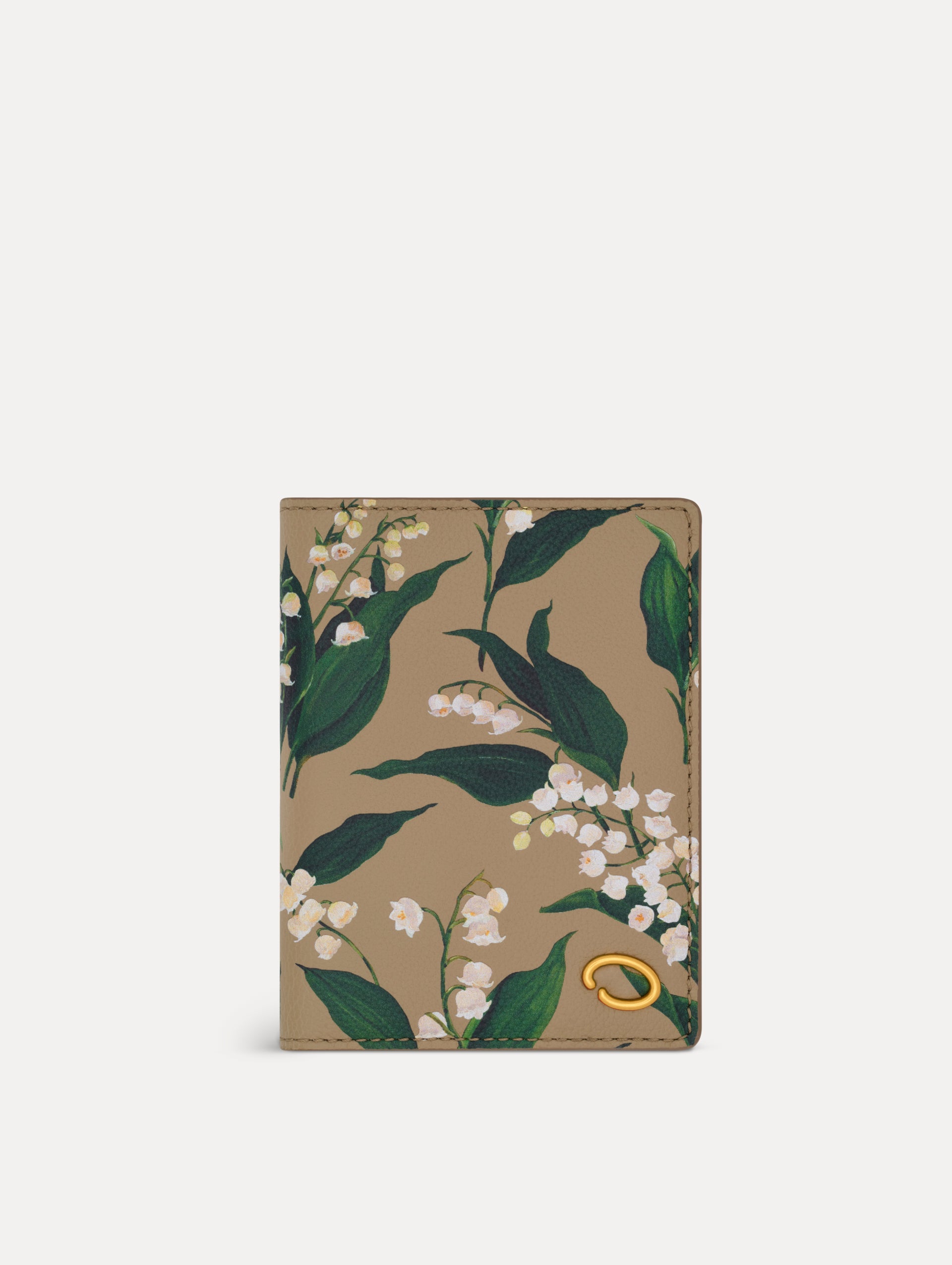 Beige Lily of the Valley–Printed Passport Cover featuring green and white floral motifs and a metal gold motif in the bottom right corner. Front View.