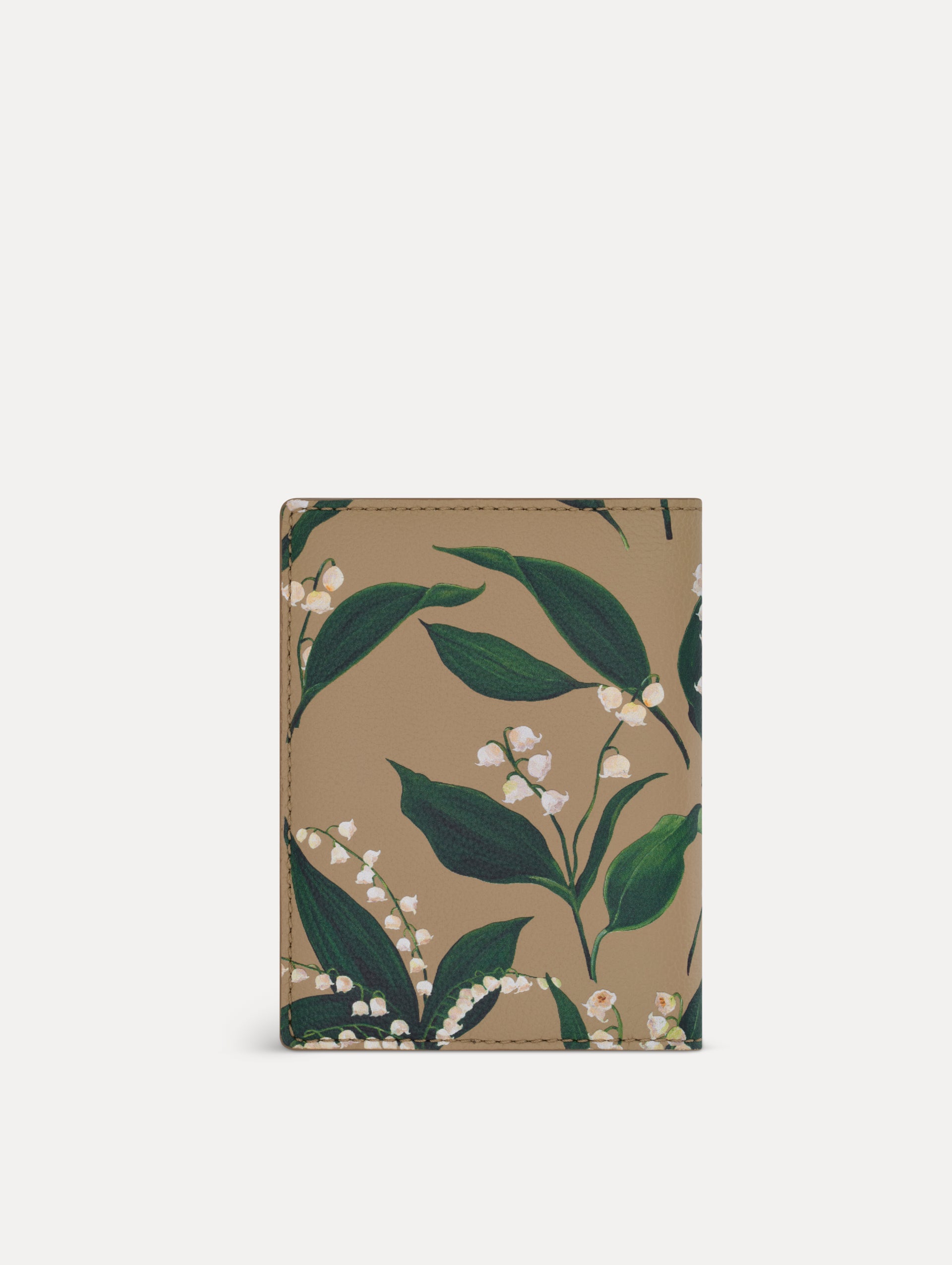 Beige Lily of the Valley–Printed Passport Cover featuring green and white floral motifs and a metal gold motif in the bottom right corner. Back View.