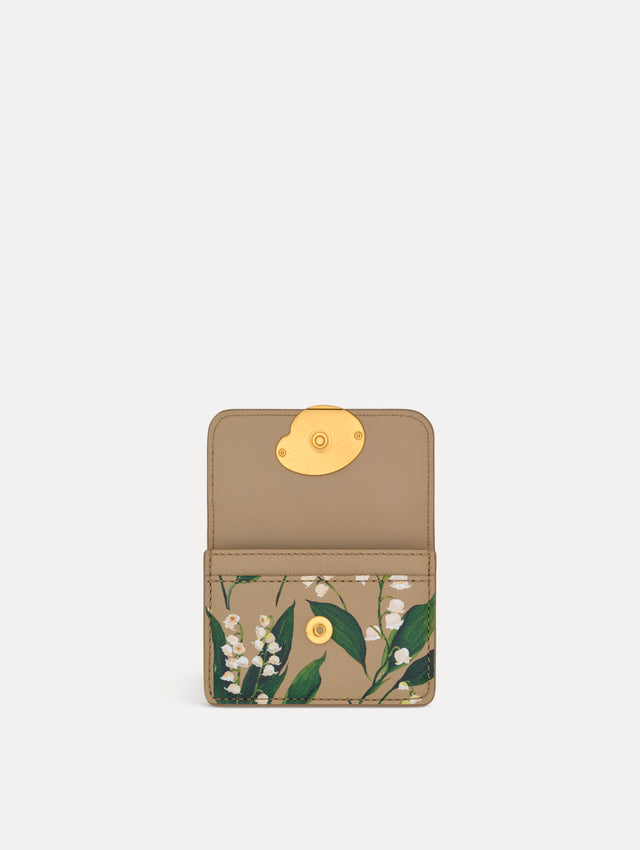 Beige Lily of the Valley–Printed Card Case with green and white floral motifs and a gold O motif clasp. Open View.