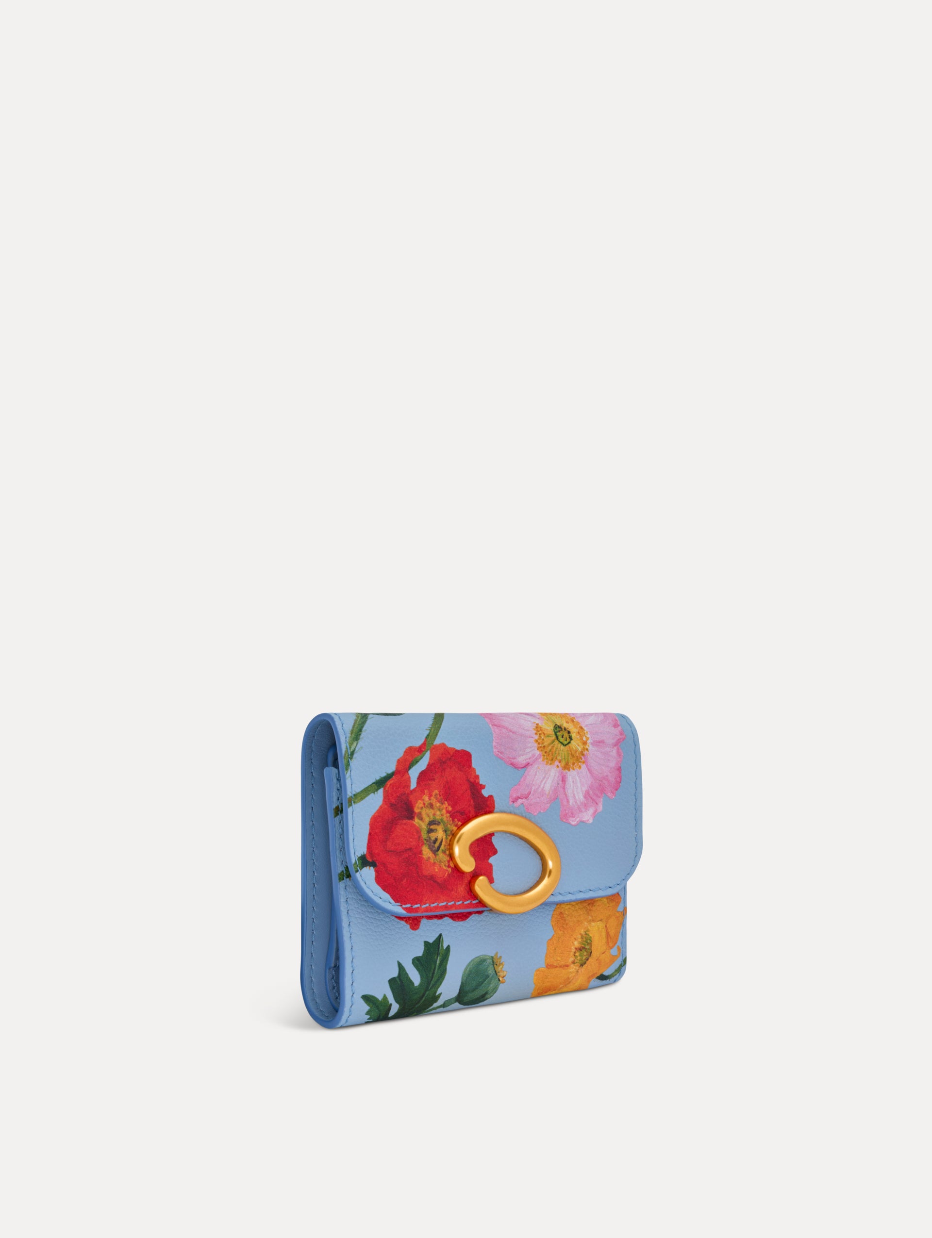 Blue Poppy Printed Tri-Fold Wallet featuring a gold O motif clasp and pink, red, and orange floral poppy motifs. Side View.