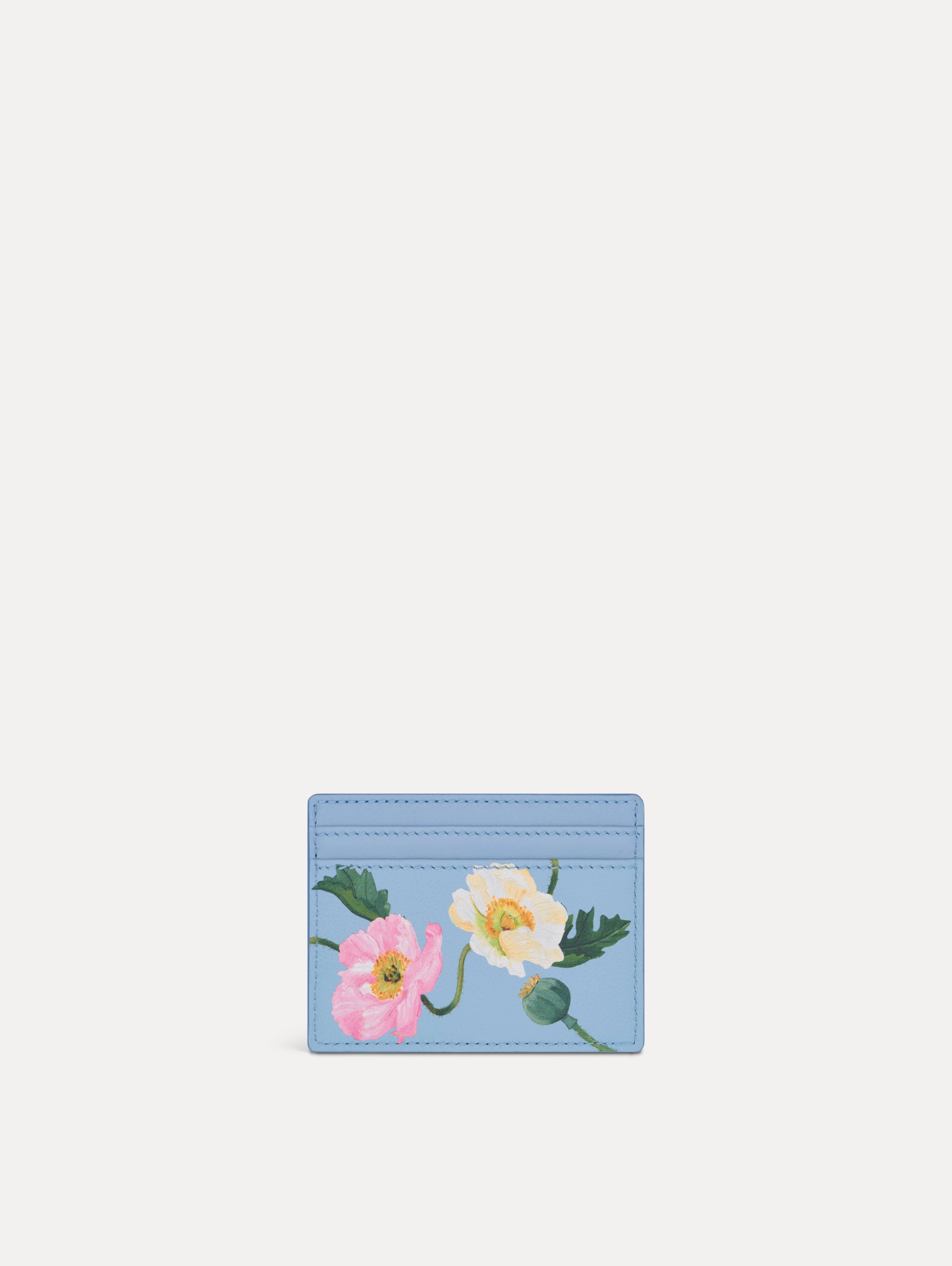 Blue Poppy Printed Card case featuring white and pink poppy floral motifs. Front View.