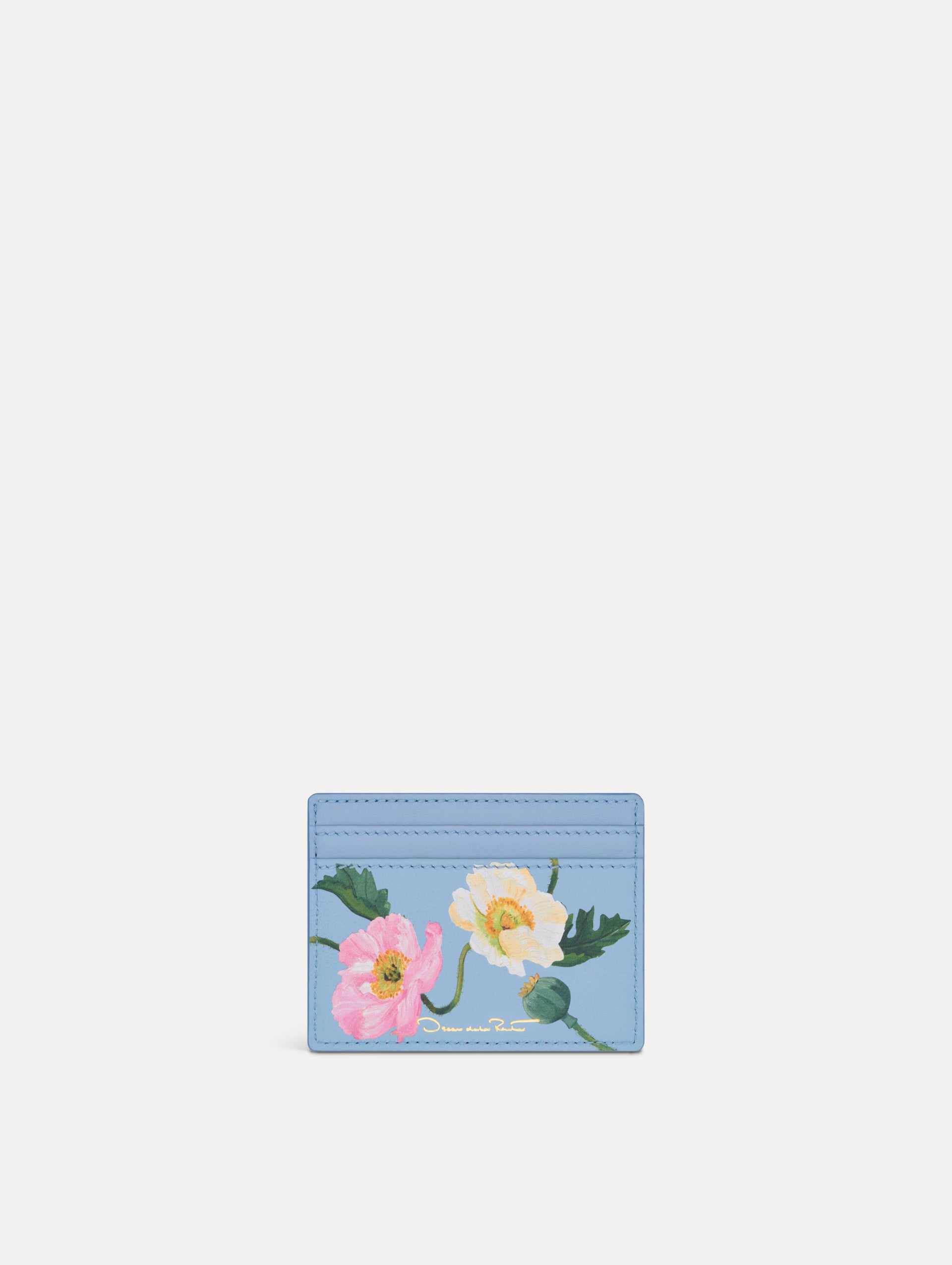 Blue Poppy Printed Card case featuring white and pink poppy floral motifs. Back View.
