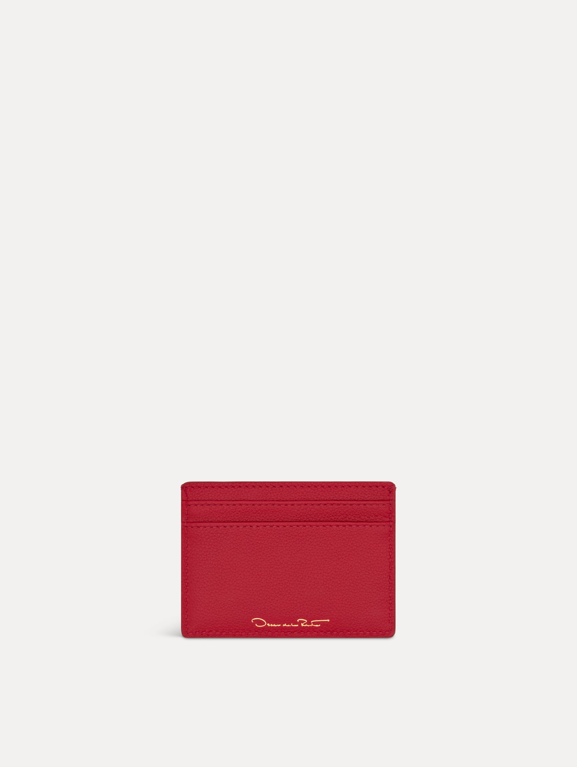Red card case featuring gold printed Oscar de la Renta logo on back. Back View.
