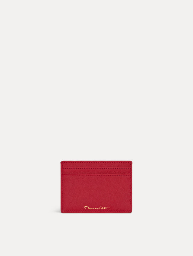 Red card case featuring gold printed Oscar de la Renta logo on back. Back View.