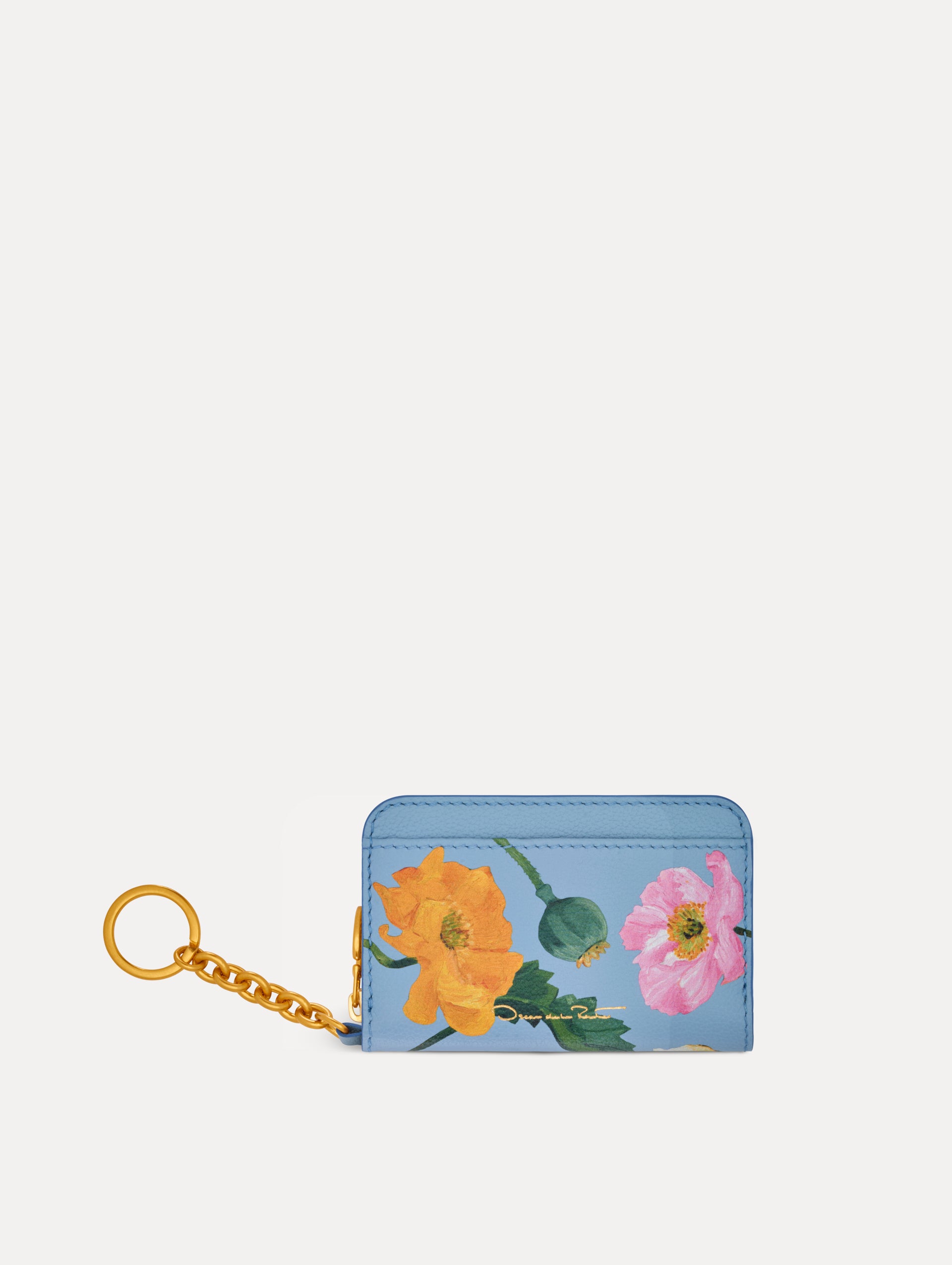 Blue Poppy Printed Zip Card case with white and red floral motifs and gold hardware. Back View.