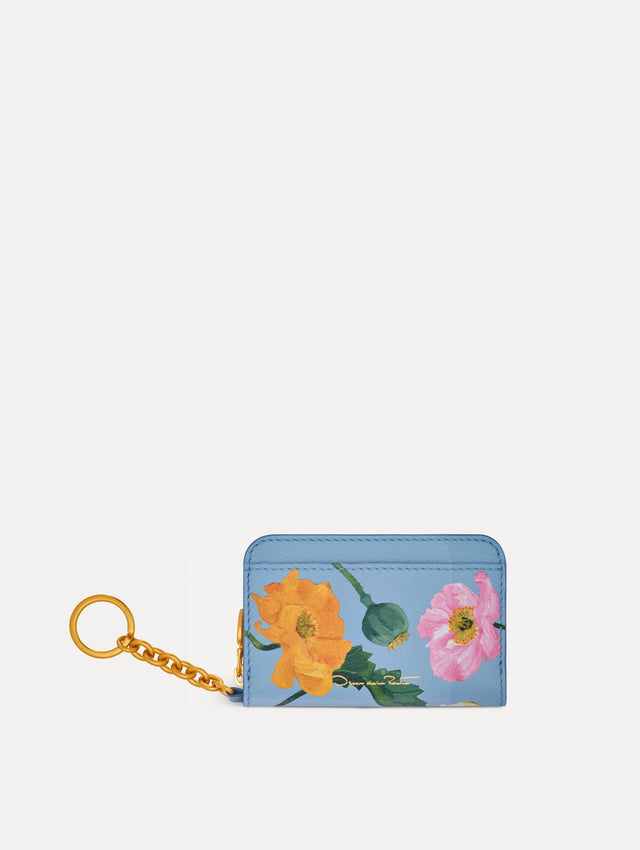 Blue Poppy Printed Zip Card case with white and red floral motifs and gold hardware. Back View.