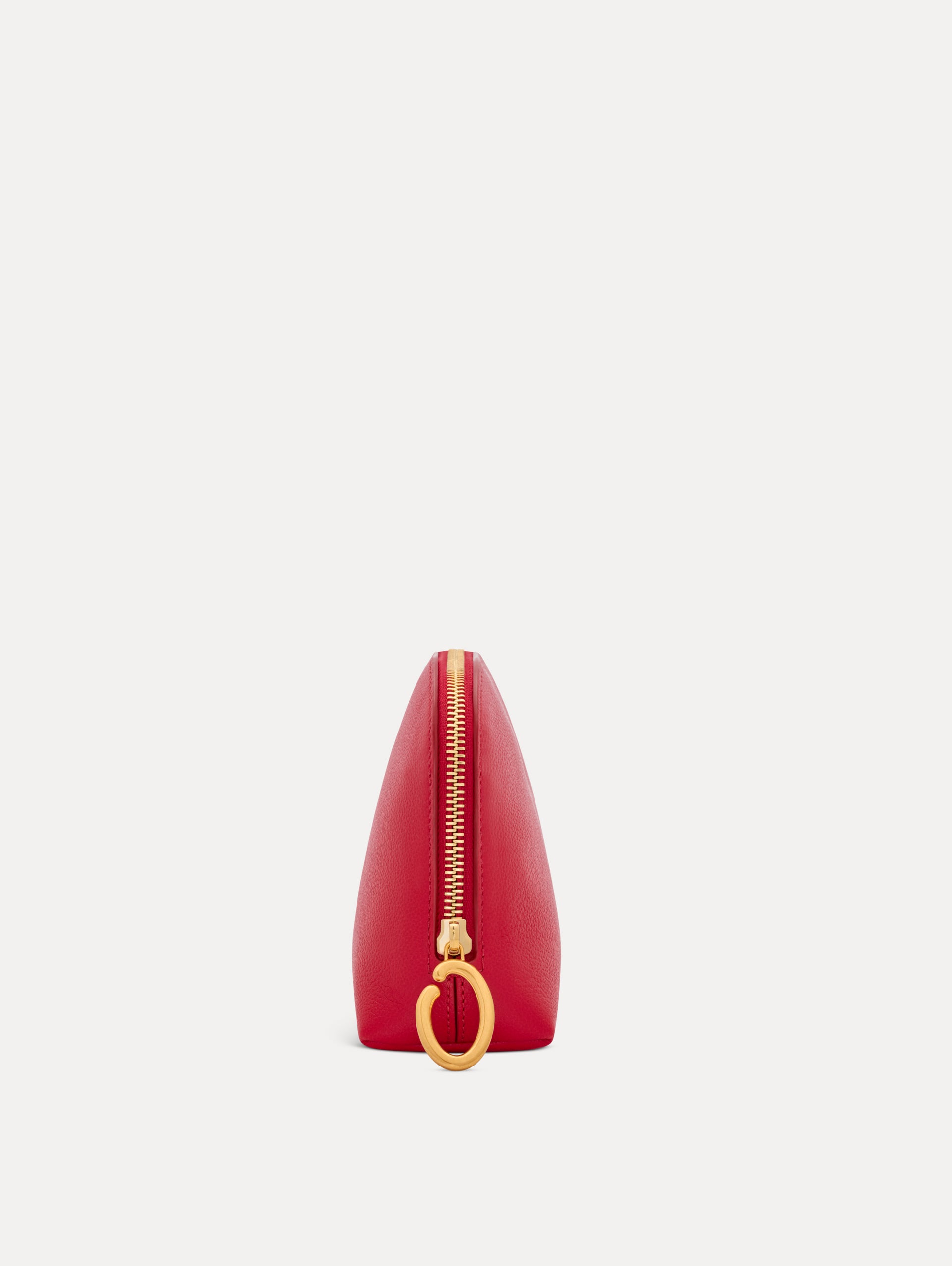 Red Medium Cosmetics case with Gold Hardware featuring an O motif zipper. Side View.