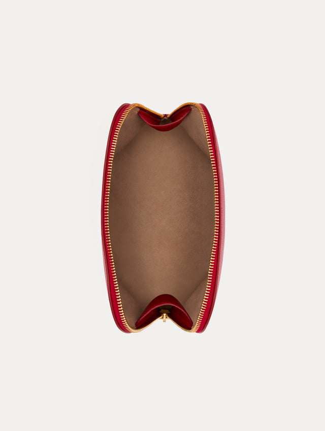 Red Medium Cosmetics case with Gold Hardware featuring an O motif zipper. Top View.