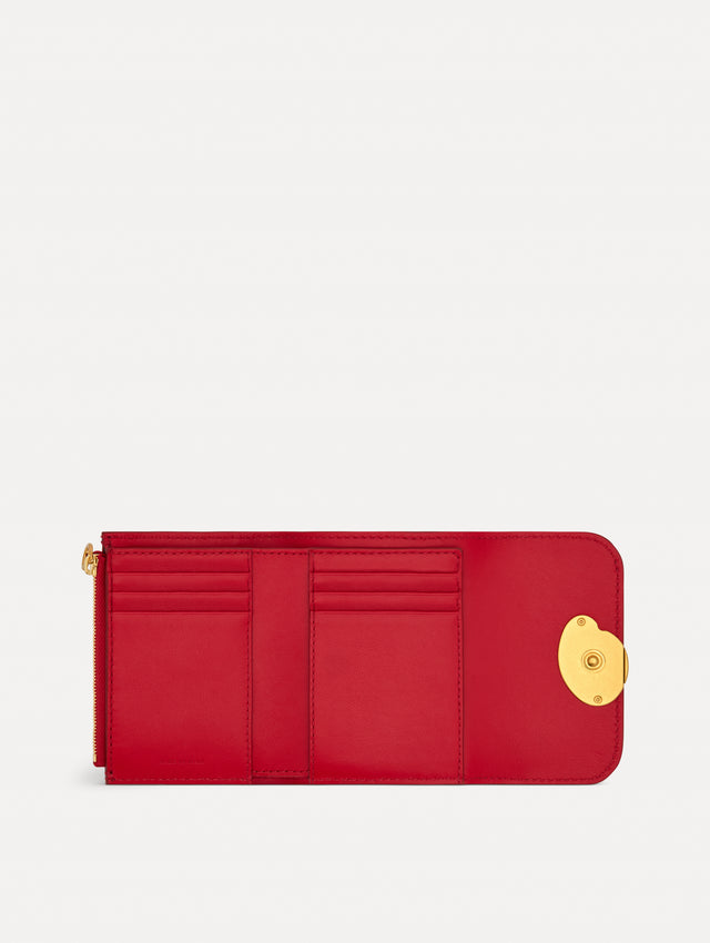 Red Tri-Fold Wallet featuring a gold O motif clasp. Open View.