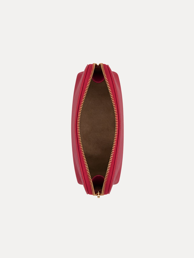Red Small Cosmetics case in leather with gold hardware featuring an O motif zipper. Open View.