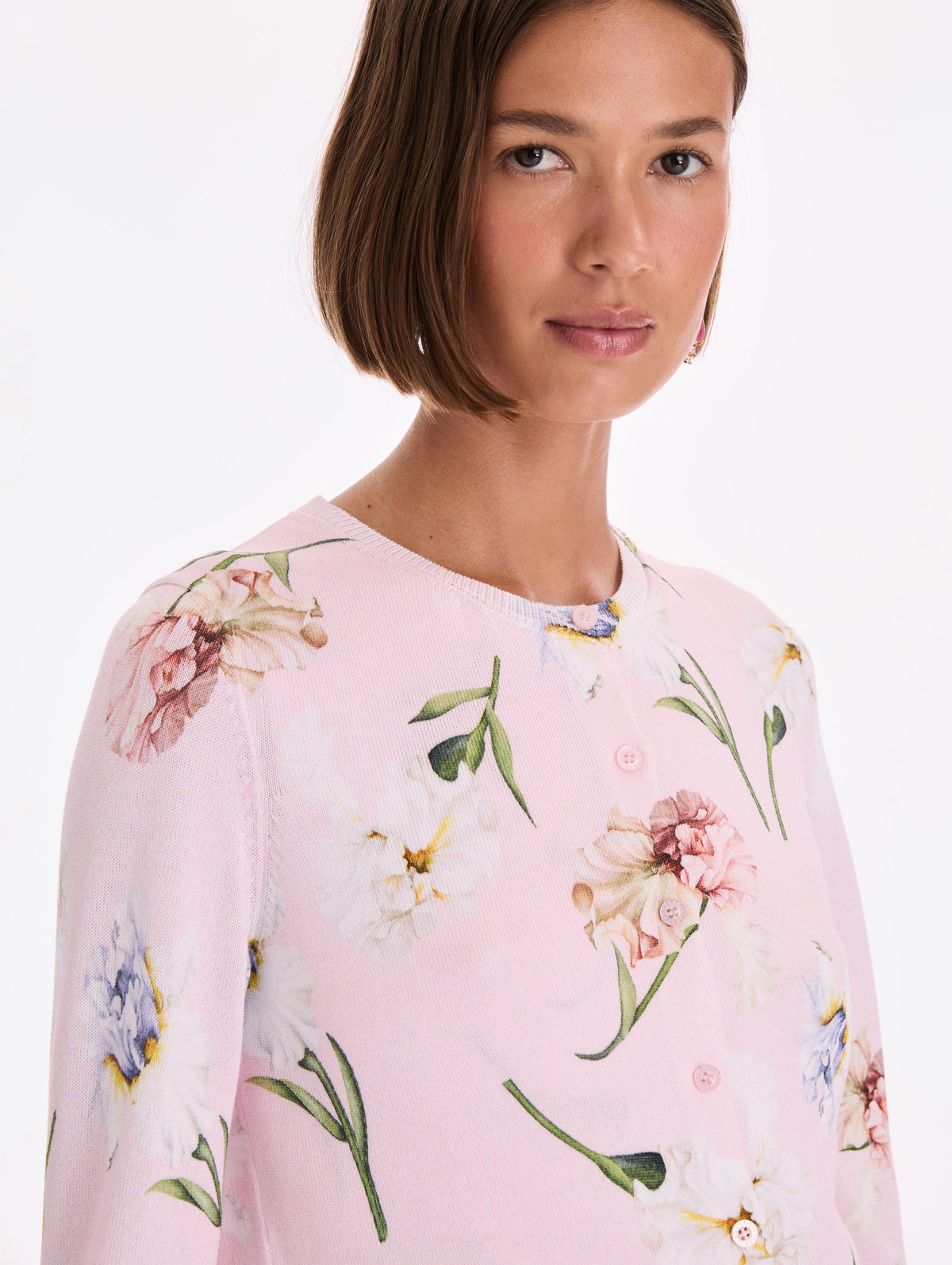 The model is wearing a printed twinset cardigan. Zoom view.