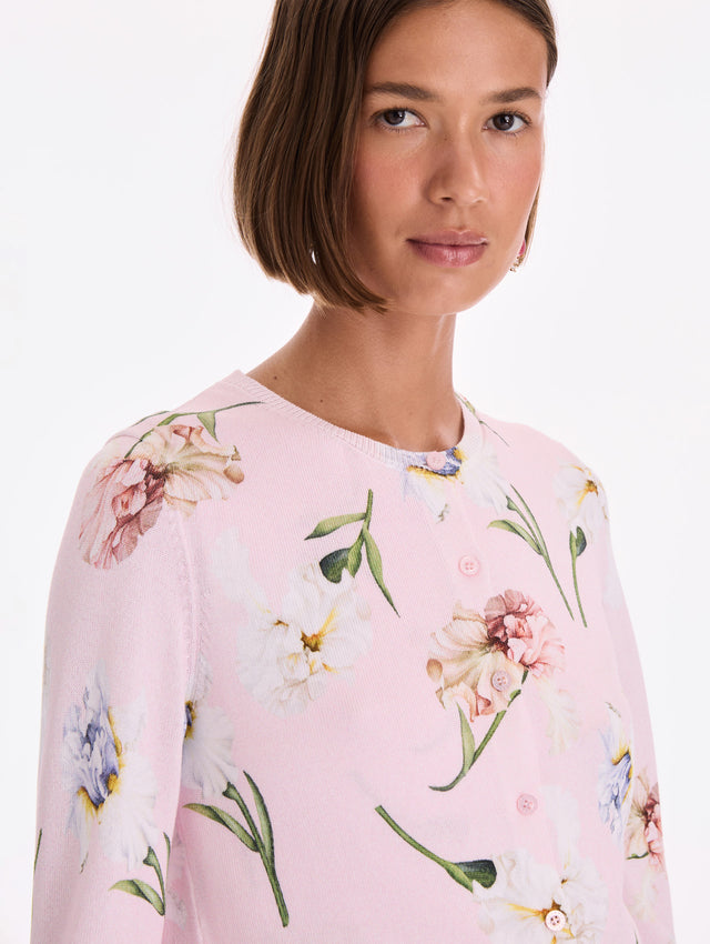 The model is wearing a printed twinset cardigan. Zoom view.