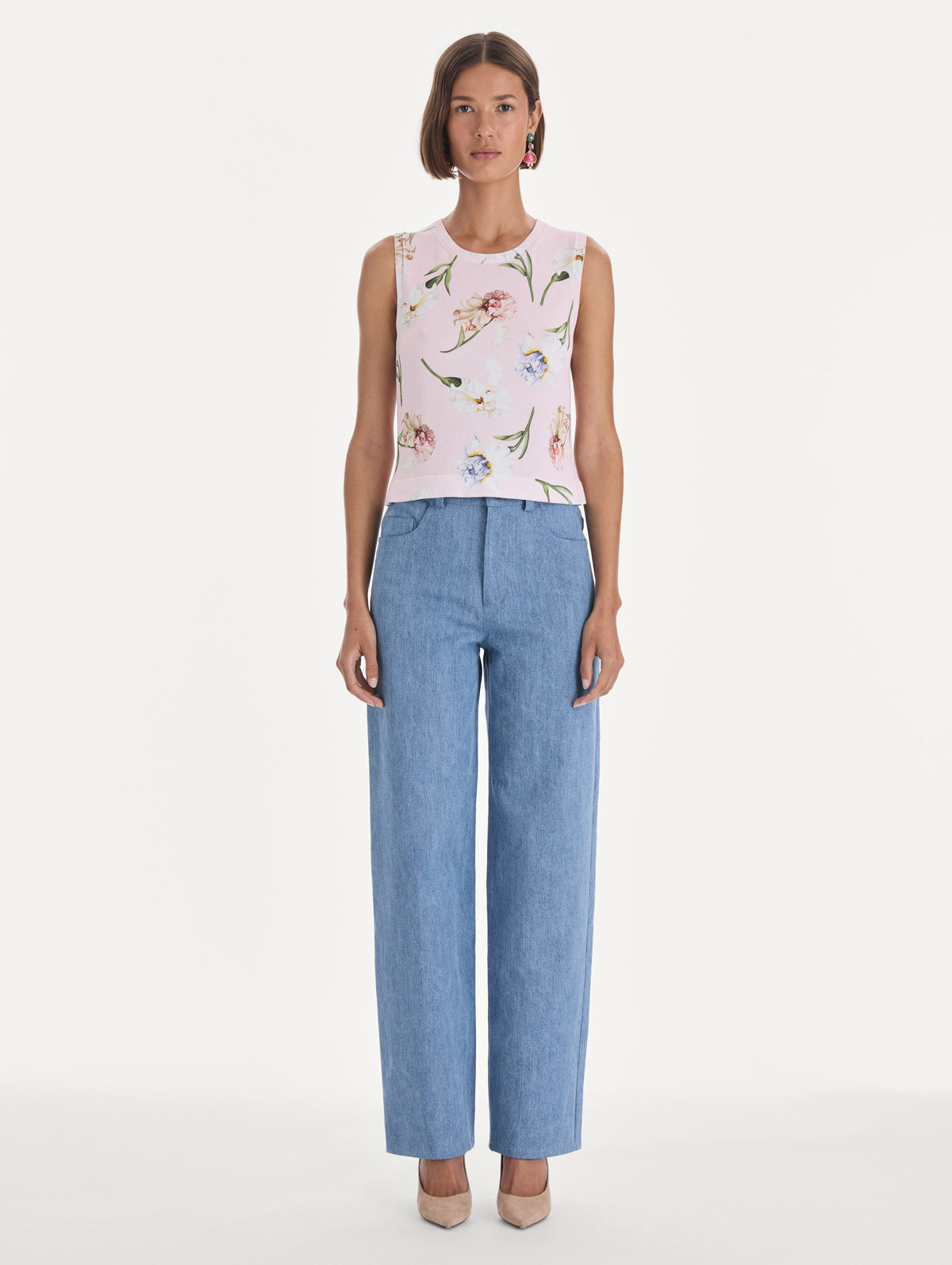 The model is wearing a printed twinset tank. Front view.