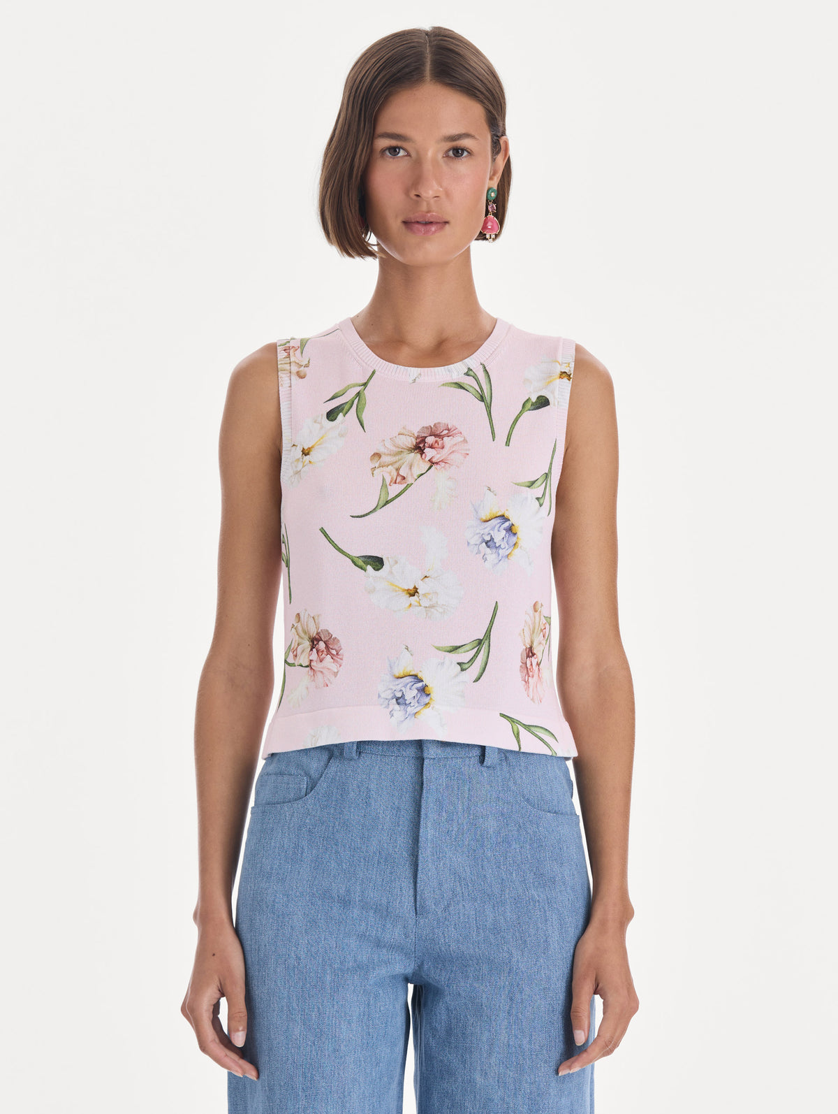 The model is wearing a printed twinset tank. Front view.