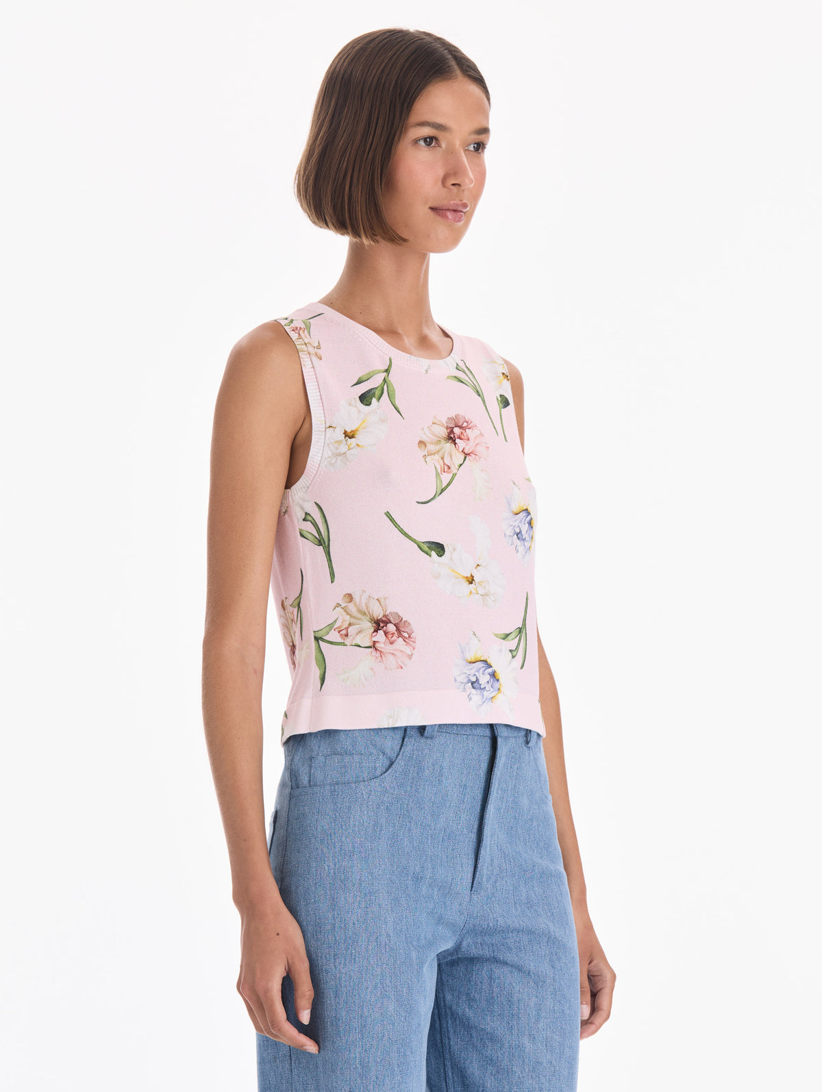 The model is wearing a printed twinset tank. Side view.