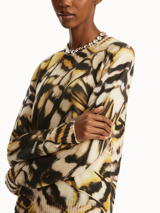 Abstract butterfly print in shades of black/brown, yellow, and white pullover. Zoom view