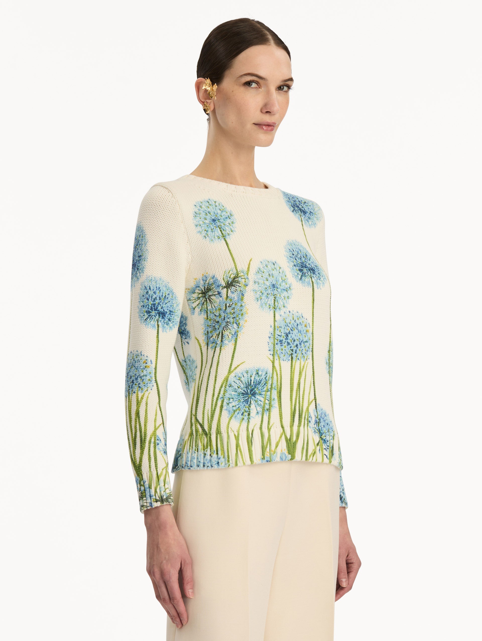Ivory Allium Printed Pullover with crew neck silhouette and blue and green floral motifs. Side View.
