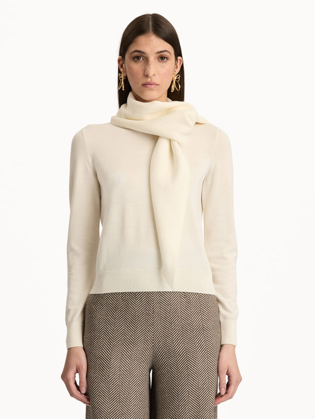 Ivory Virgin Wool Pullover with Scarf featuring a draped attached scarf neckline and long sleeves. Front View.