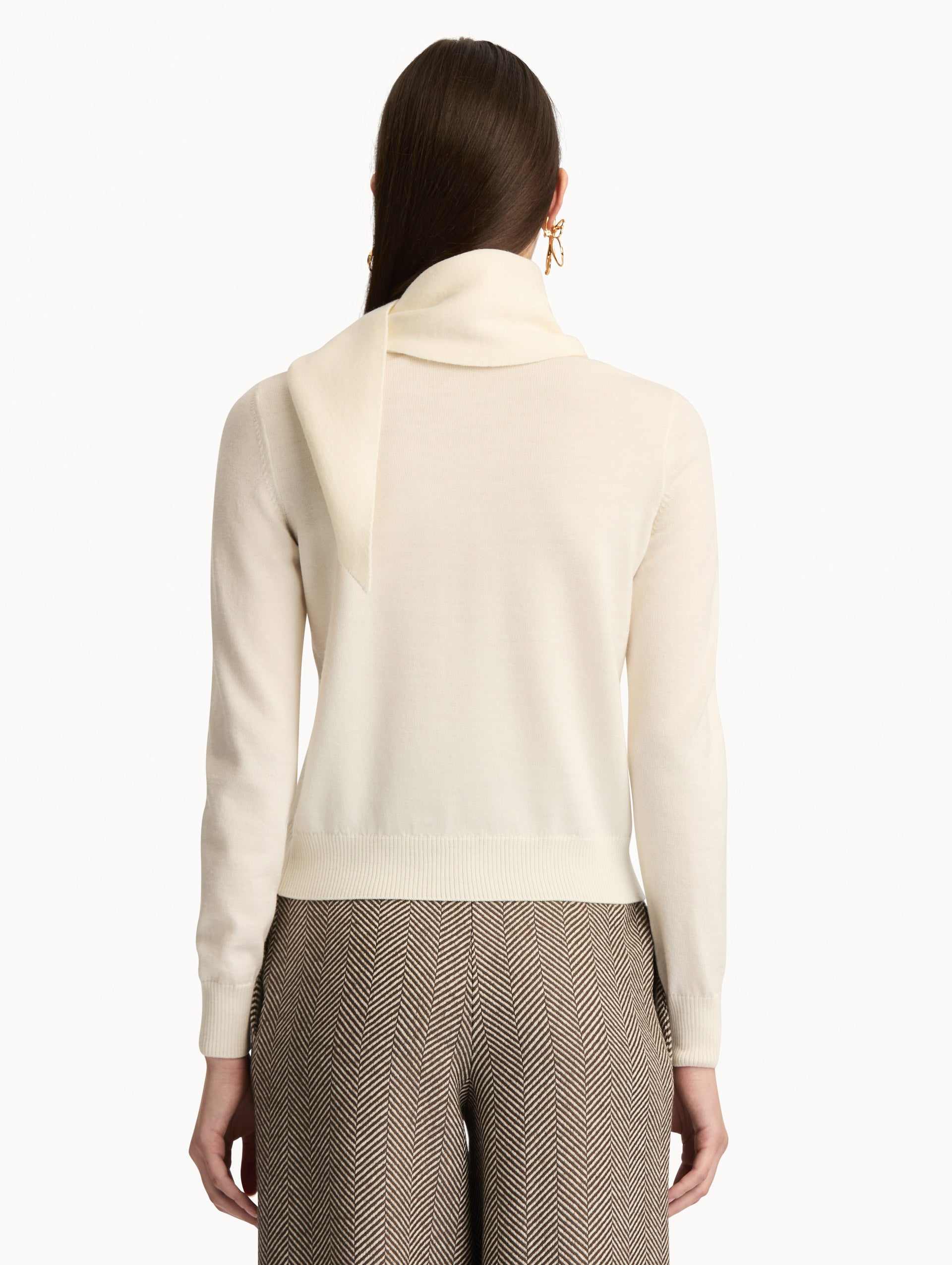 Ivory Virgin Wool Pullover with Scarf featuring a draped attached scarf neckline and long sleeves. Back View.