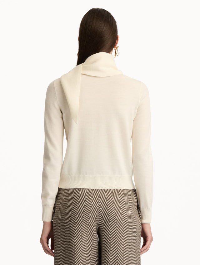 Ivory Virgin Wool Pullover with Scarf featuring a draped attached scarf neckline and long sleeves. Back View.