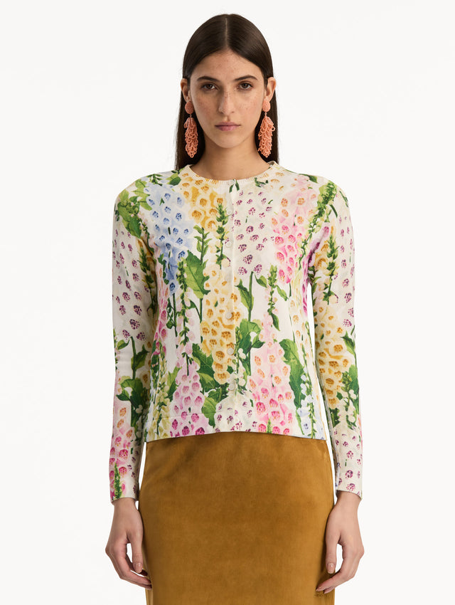 White Foxglove Printed Cardigan featuring multicolor foxglove motifs in yellow, pink, and green. Front View.