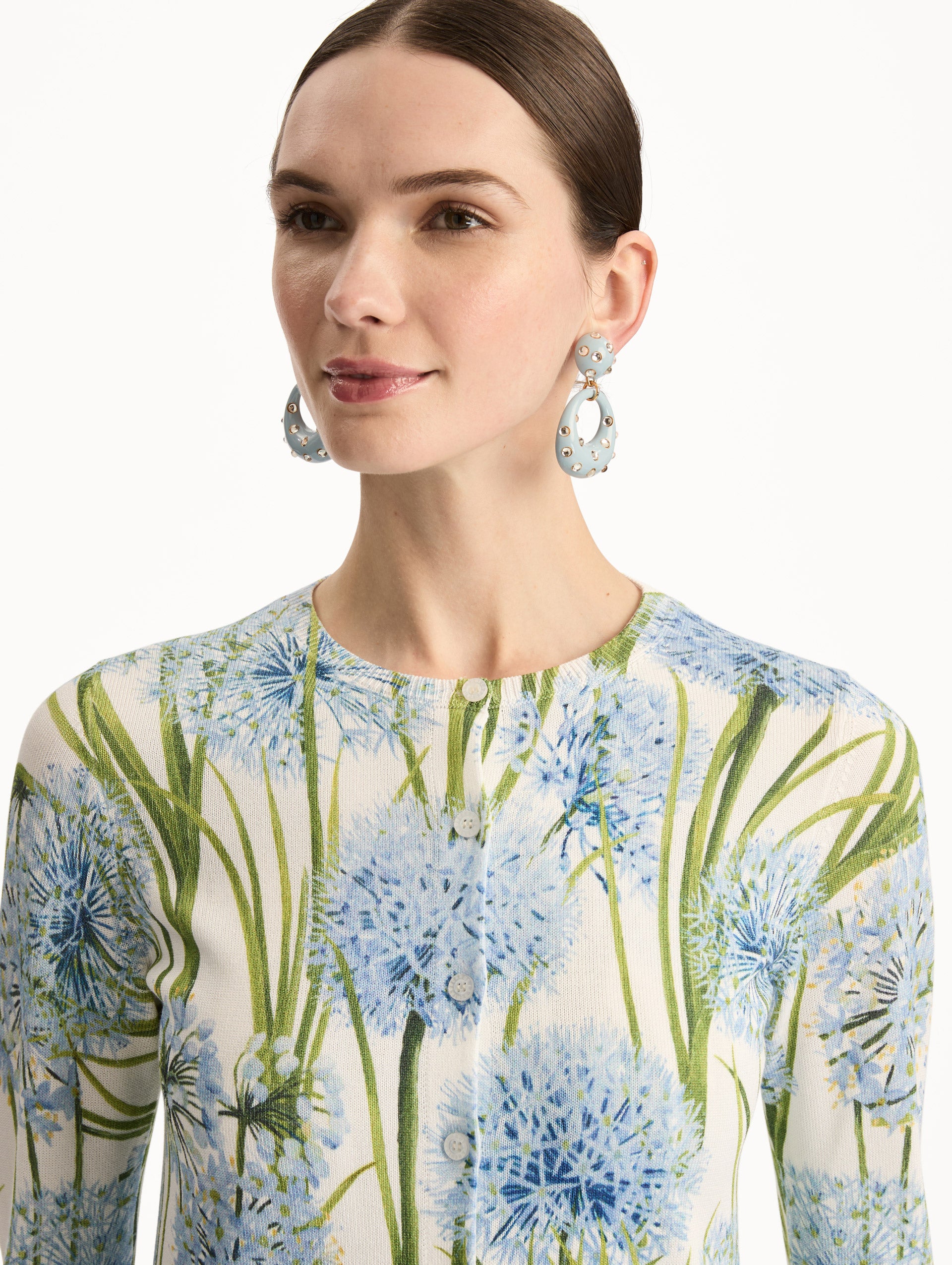Ivory Allium Printed Cardigan with blue and green floral motifs. Zoom View.