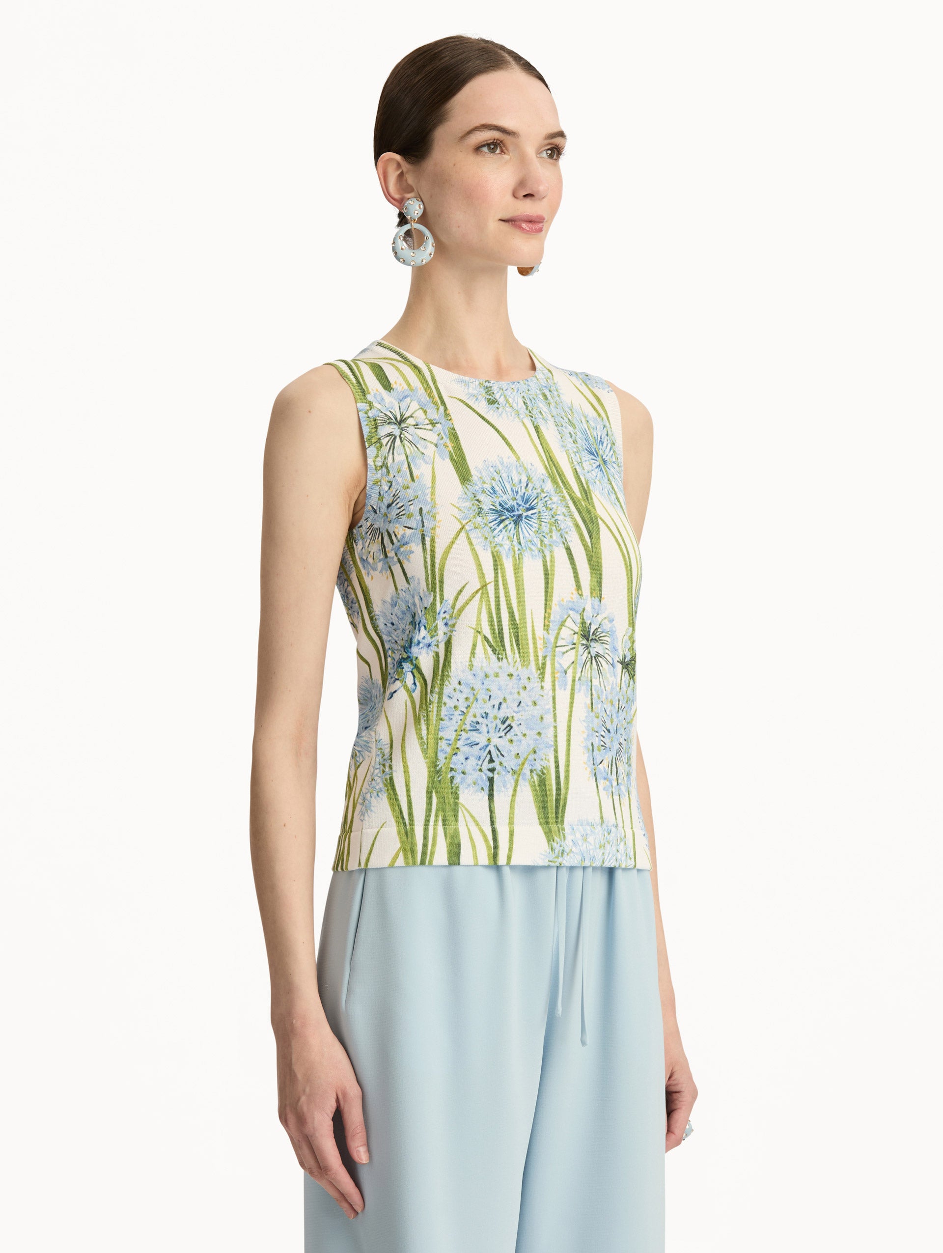 Ivory Allium Printed Tank with knit texture and blue and green floral motifs. Side View.