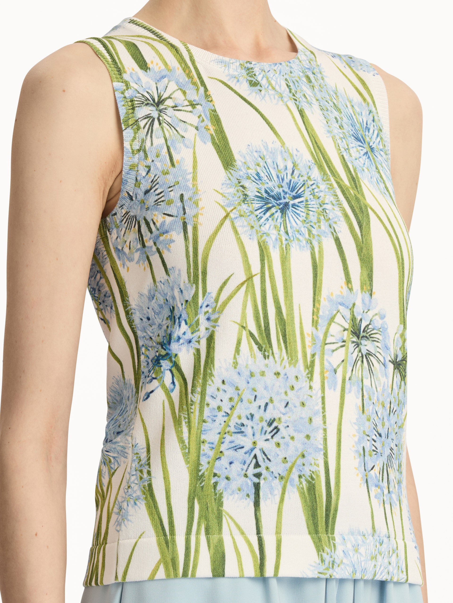 Ivory Allium Printed Tank with knit texture and blue and green floral motifs. Zoom View.