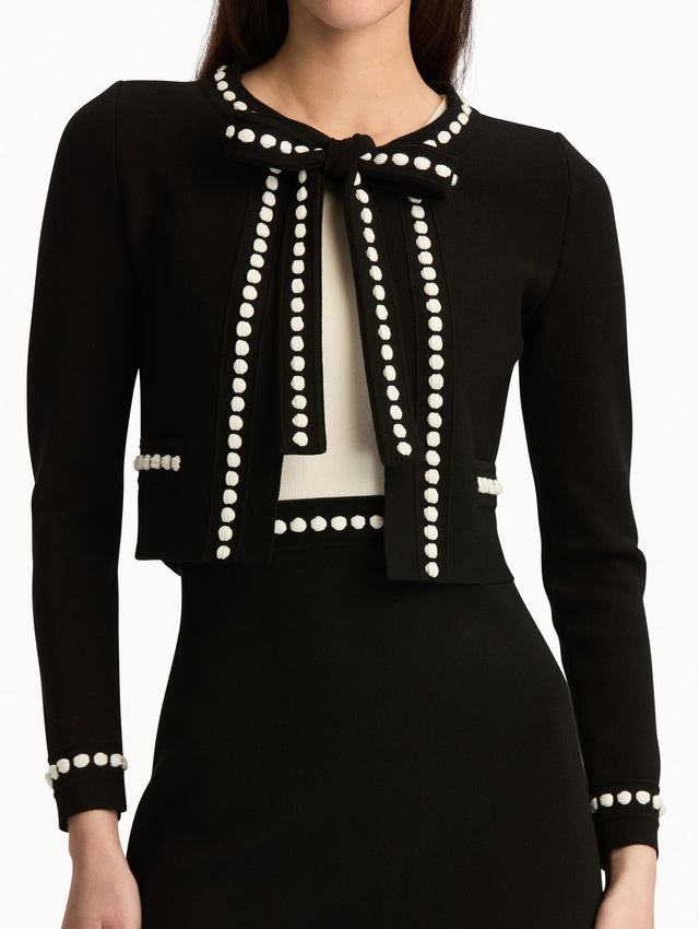Black and White Bubble Trim Cardigan featuring white beaded trim, long sleeves, and a tie-neck collar. Zoom View.