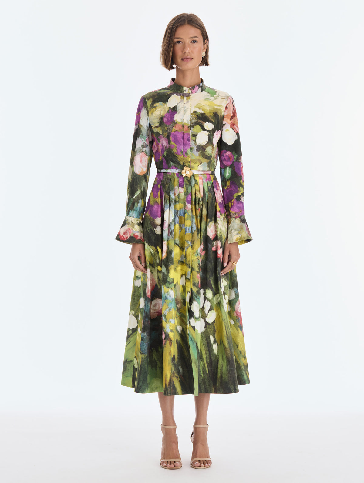The model is wearing a long sleeve abstract garden poplin sateen dress. Front view.