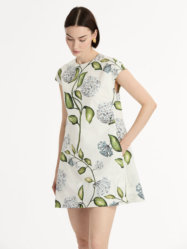 Porcelain Flower Cotton Poplin A-Line Mini Dress. Short Sleeves. Blue and Green Floral Motif. Side View.