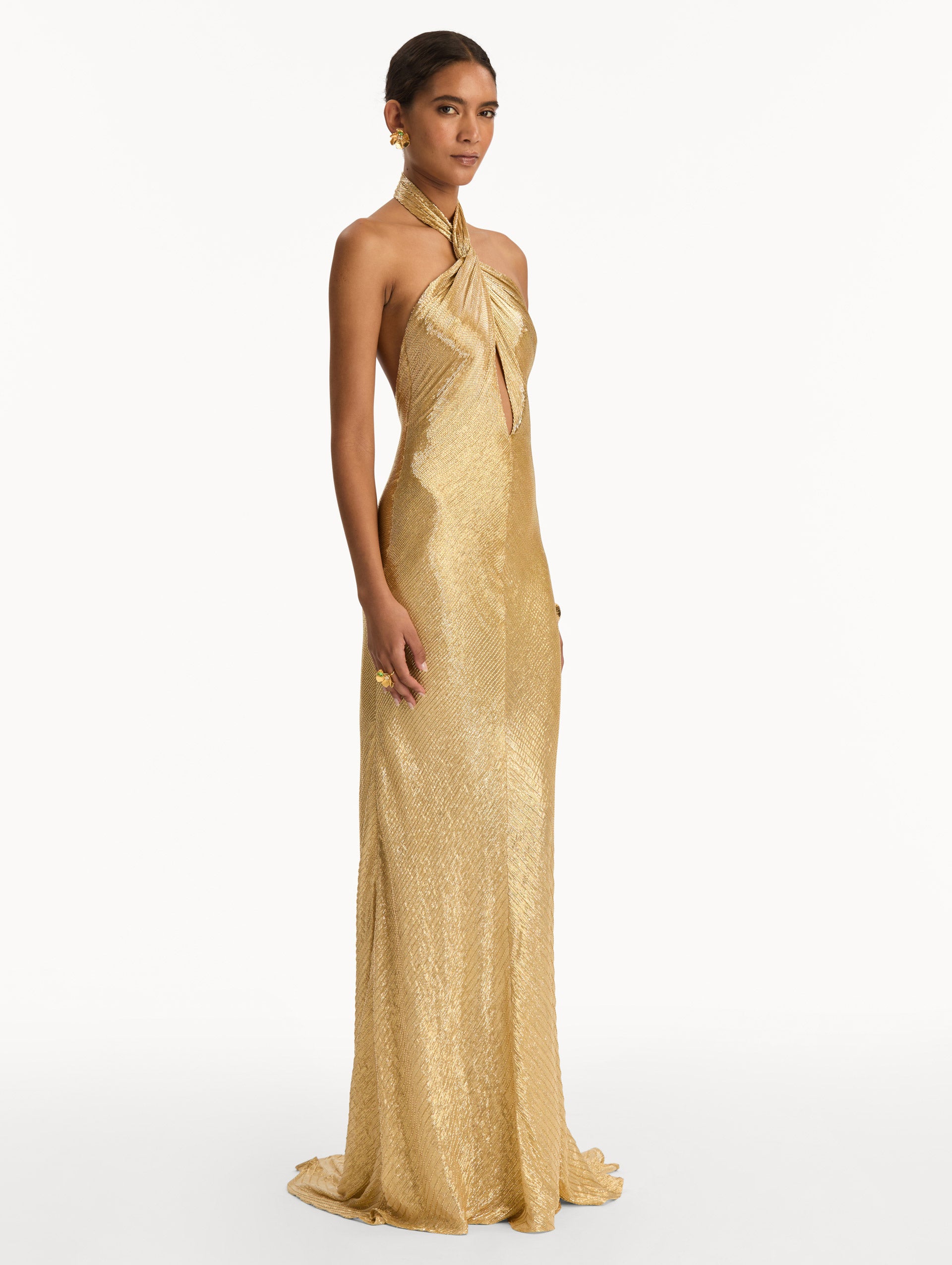 Gold Bugle Bead Lamé Gown with halter neck and key hole. Side View.