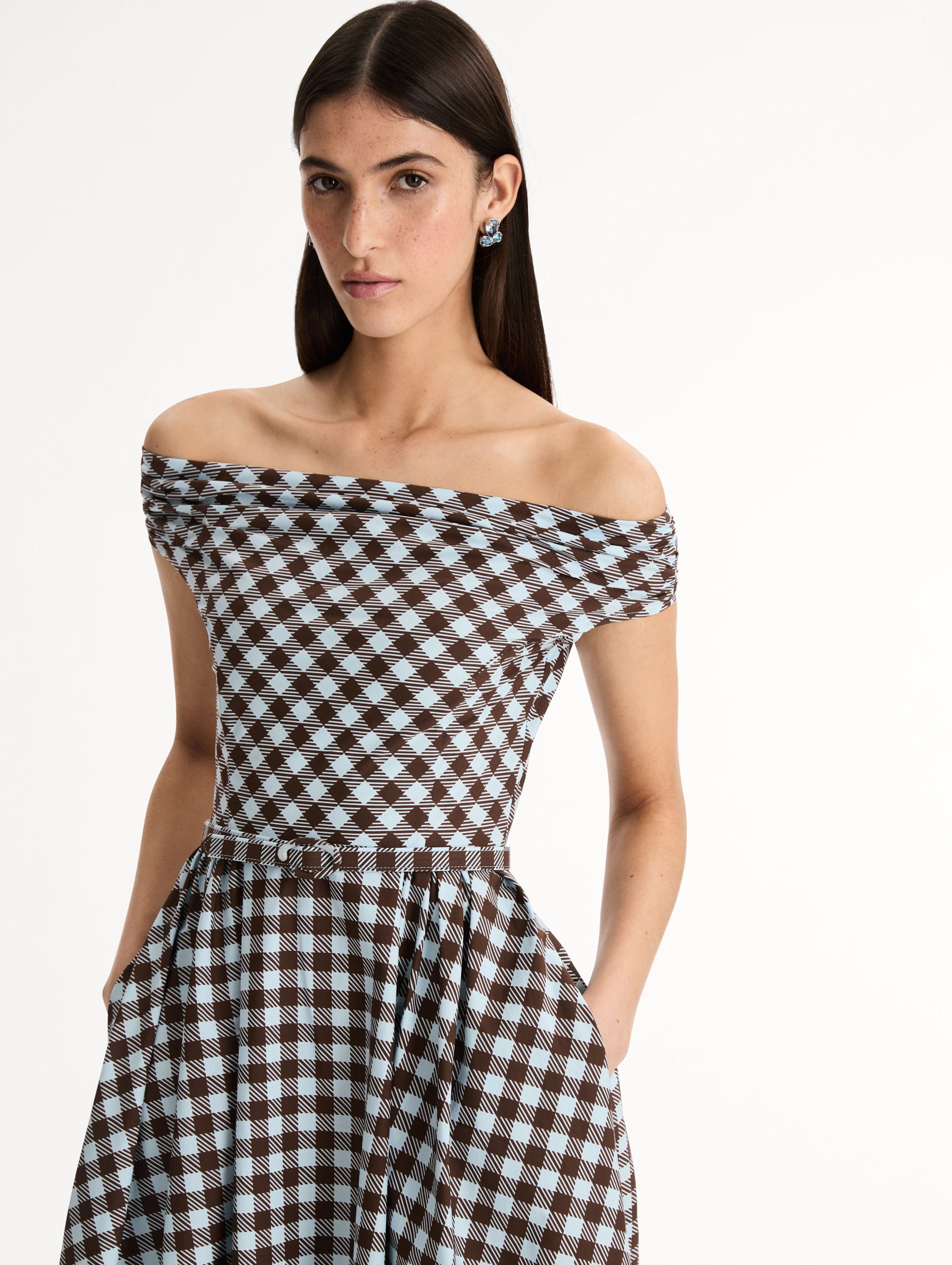 Gingham Cotton Poplin Midi Dress  in ice blue and mahogany. Off-shoulder neckline and pleated skirt. Front View, Close Up. 