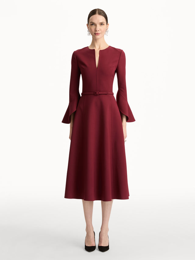 Wine colored Split Neck Wool Dress with belted waist and flowing bell sleeves. Front View.