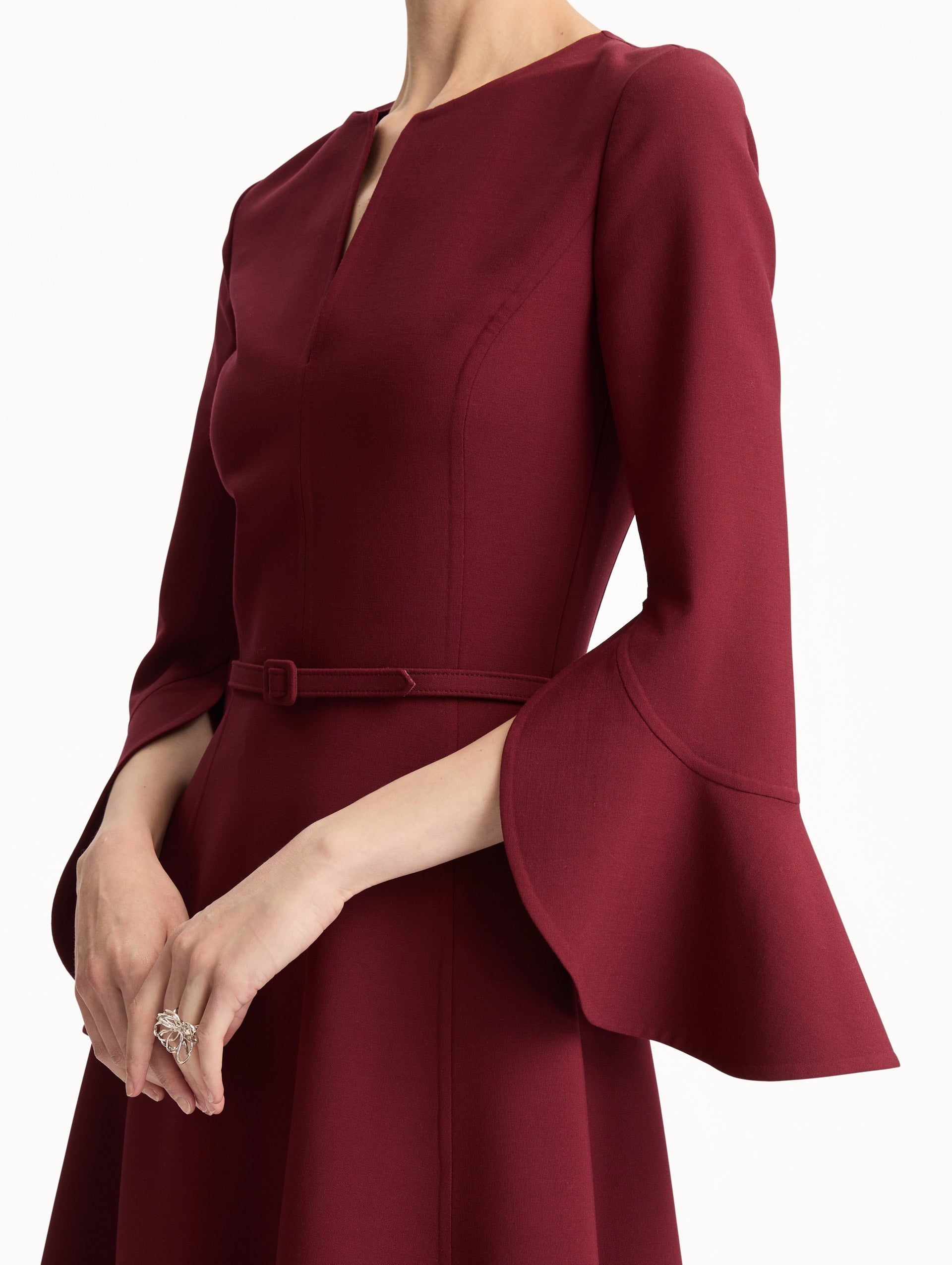 Wine colored Split Neck Wool Dress with belted waist and flowing bell sleeves. Zoom View.