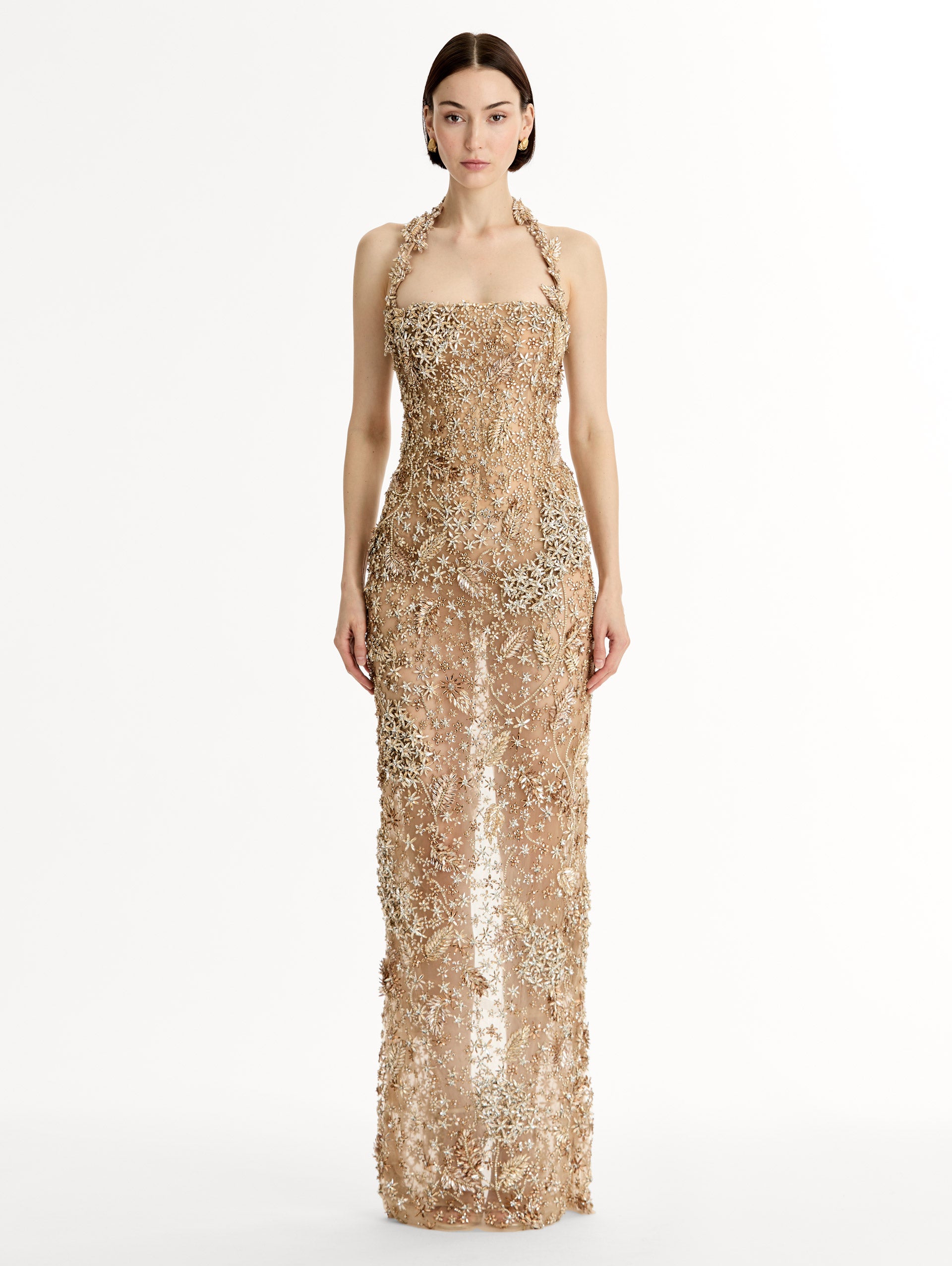 Floor length halter gown with intricate porcelain flower crystal embroidery. Sheer silhouette. Front View. 