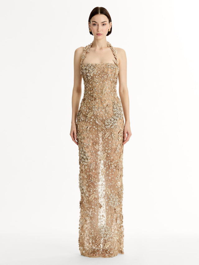 Floor length halter gown with intricate porcelain flower crystal embroidery. Sheer silhouette. Front View. 