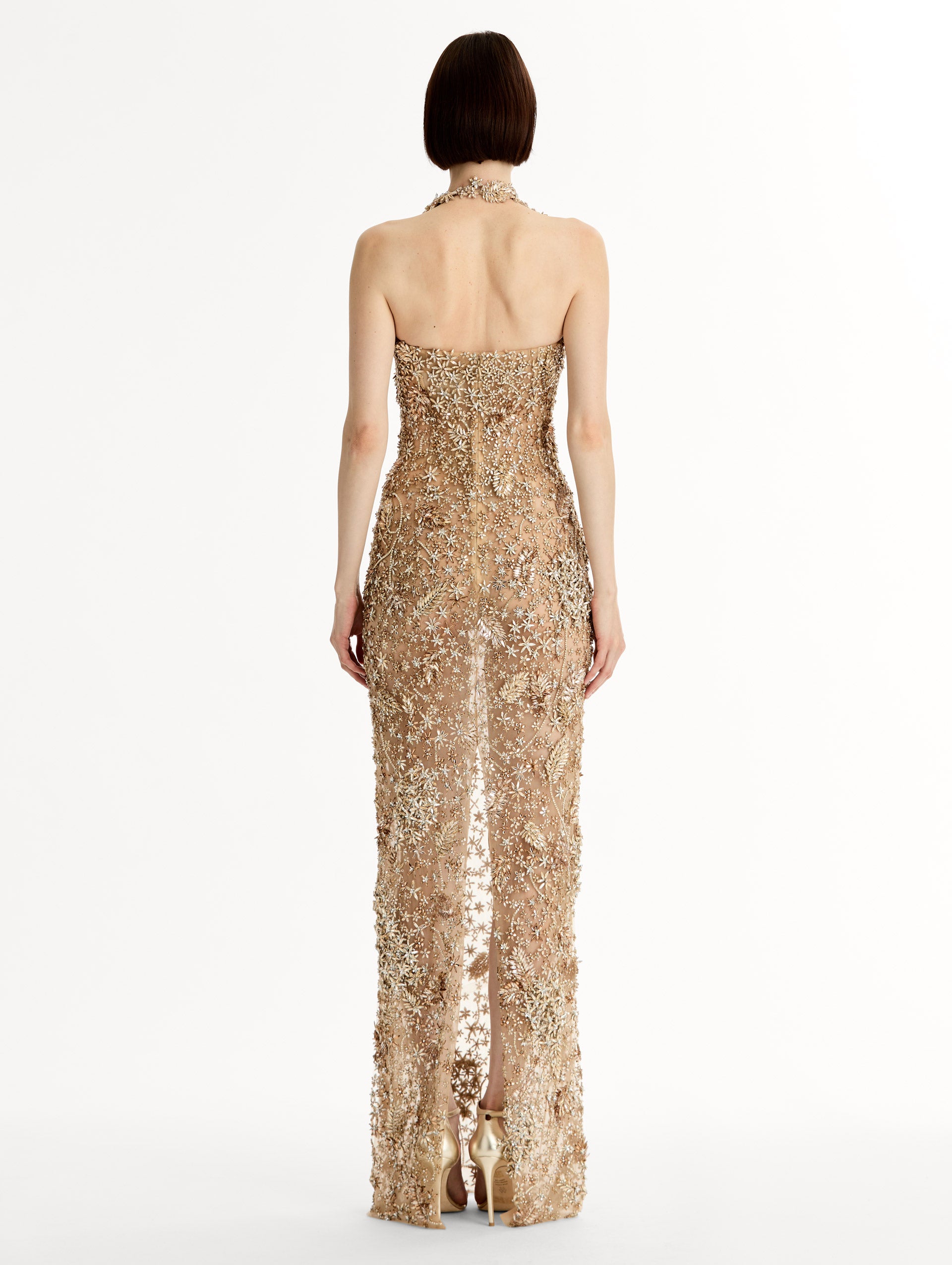 Floor length halter gown with intricate porcelain flower crystal embroidery. Sheer silhouette. Back View. 