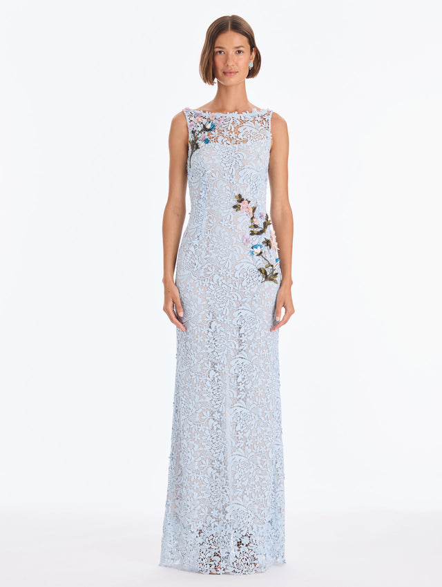 The model is wearing a sleeveless chrysanthemum guipure embroidered gown. Front view.